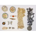 A quantity of costume jewellery to include brooches, chain necklaces and jewellery boxes (1 box)