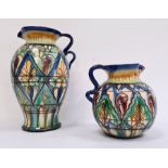 Pair graduated continental glazed terracotta jugs with sgraffito decoration (2)