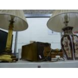 Brass-coloured table lamp formed as a Corinthian column, on stepped base, with shade, an Oriental-