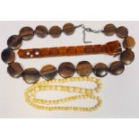 19th century ivory-effect graduated beads, a rosewood carved beaded necklace and an amber-effect