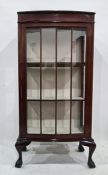 Late 19th/early 20th century mahogany display cabinet with glazed door enclosing three shelves,