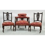 Victorian mahogany-framed salon chair with red ground foliate patterned upholstery and two similarly
