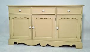 20th century painted pine sideboard with three drawers above three cupboard doors, bracket feet,