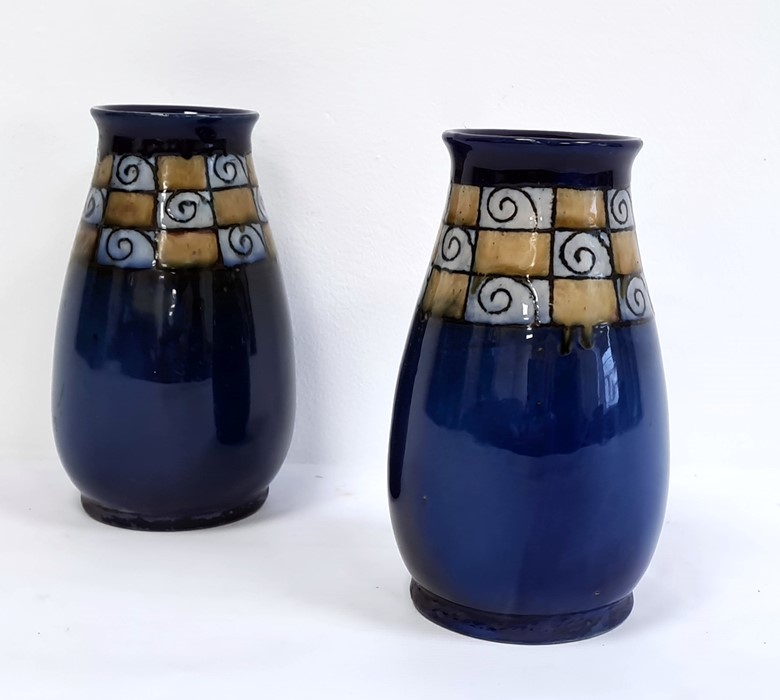 Pair of blue glazed Royal Doulton vases with stylised border (2)