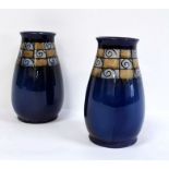 Pair of blue glazed Royal Doulton vases with stylised border (2)