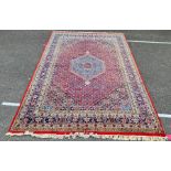 Persian rug with central medallion, foliate decorated field, stepped border, 300 x 203cm