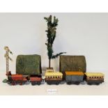 Quantity of '0' gauge clockwork trains to include Hornby engine, various carriages, track, etc