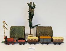Quantity of '0' gauge clockwork trains to include Hornby engine, various carriages, track, etc