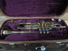 Cased brass trumpet by Boosey and Hawkes