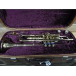 Cased brass trumpet by Boosey and Hawkes