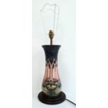 Moorcroft pottery table lamp, tall baluster pattern, in Cluny design, on stepped wooden base, 33cm