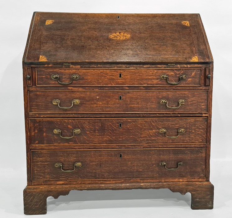 Oak bureau with decorative shell inlay to fall, four graduated long drawers, bracket feet, 96cm x