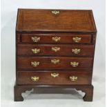 Georgian mahogany bureau with four long drawers, raised on bracket feet, brass handles and