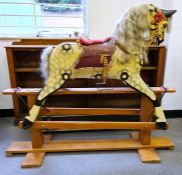 Rocking horse with painted carved wooden body, horse hair mane and tail on pine base