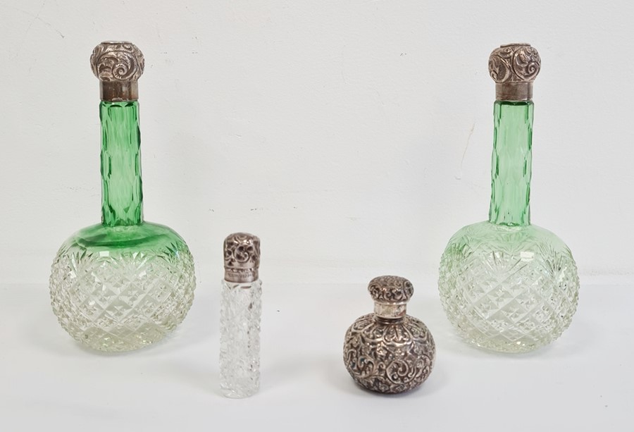 Pair of Victorian green cut glass hobnail perfume bottles with silver embossed tops, a small example