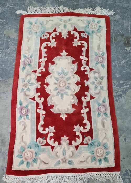 Chinese red ground rug, 168cm x 90cm