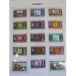 Guernsey collection of stamps in SG printed album UM few wartime issues appears complete to 2002 (
