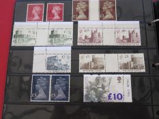 Stockbook with £100+ mint decimal stamps including £10 and 4 and 5 values and many sheets, etc (1)