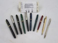 Swan Mabie Todd black fountain pen, a Vigzol gilt metal propelling pencil, a Parker Slimfold