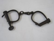 Pair Haitt cast iron handcuffs with key