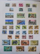 Album of Kenya, Uganda and Tanganika stamps, 1922 set to £1 mounted mint, 1935 set mounted mint, £