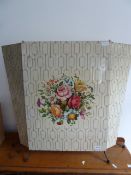1950's metal folding fire-screen, printed with geometric design and a central floral display, on