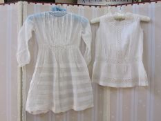 Child's dress, a linen smocked top, an underdress and a lace top with collar, floral decoration