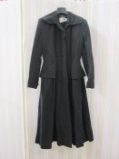 A black 1950's evening coat labelled Verner Vogue Francis Stuart Piccadilly, half peplum, fitted