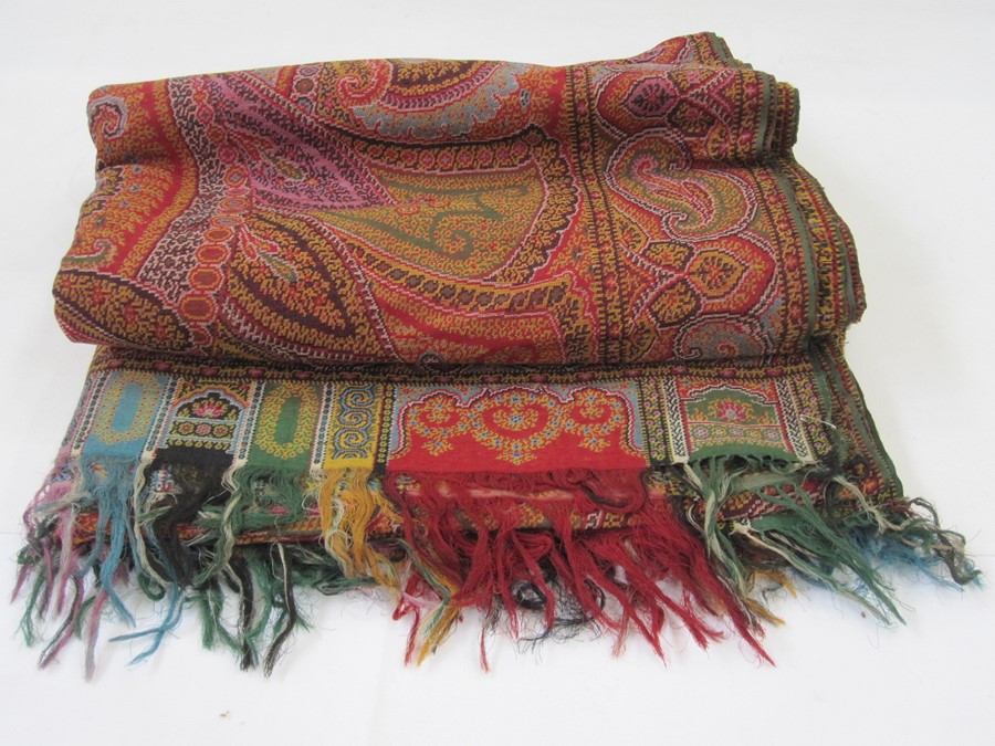 Early 20th century woven paisley shawl, allover colours green, red, turquoise, etc, the border in