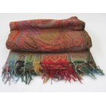 Early 20th century woven paisley shawl, allover colours green, red, turquoise, etc, the border in