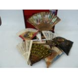 A quantity of souvenir Spanish wooden and plastic fans in a case