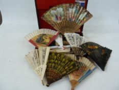 A quantity of souvenir Spanish wooden and plastic fans in a case