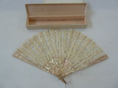 A 19th century mother of pearl and lace fan, with plain mother of pearl guards, floral decoration to