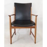 Circa 1960's/70's rosewood framed armchair with black vinyl seat and back, on circular supports