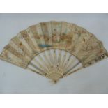 A 19th century bone and paper painted fan, the central cartouche decorated with figures fishing,