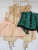 Vintage corset, with suspenders, assorted vintage and later underwear and a green satin corset