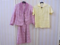 A pink crimplene shift dress with jacket labelled Begeka, Switzerland dress with belt, and a white