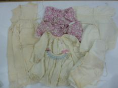 Quantity of babygowns, to include silk with smocking, matching knickers, cream wool wool jacket