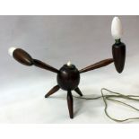 A 20th Century wooden table lamp, two arms on a circular body on three splayed legs