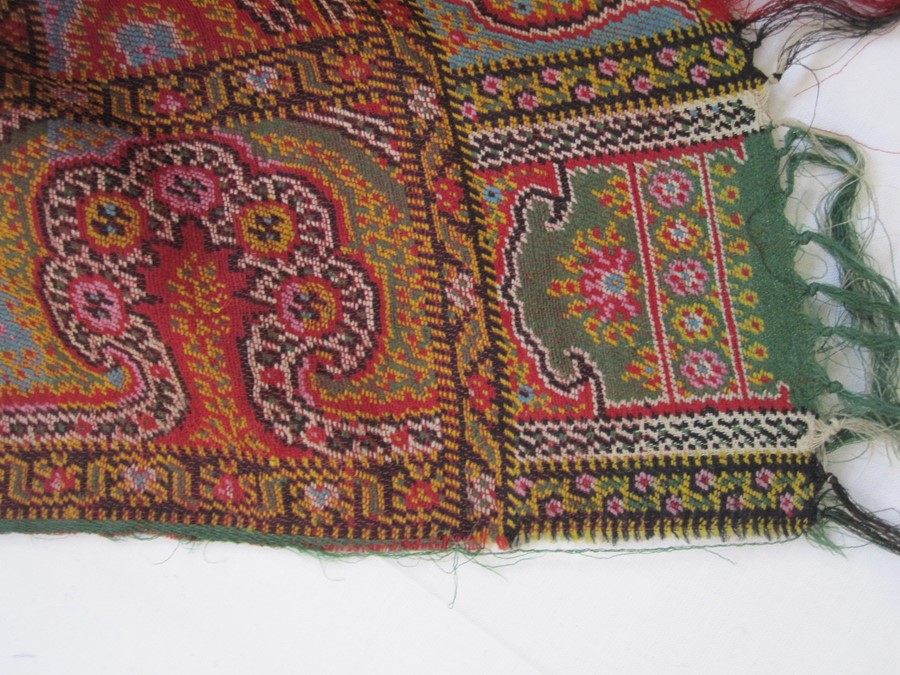 Early 20th century woven paisley shawl, allover colours green, red, turquoise, etc, the border in - Image 2 of 2