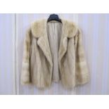 Short blond mink jacket with bell sleeves