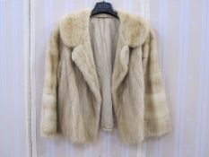 Short blond mink jacket with bell sleeves