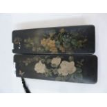 Two oriental lacquered glove boxes, black lacquer with red interiors, floral decorated 30 cm x 9.5cm