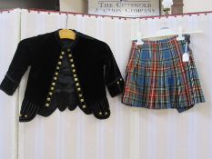 Black velvet waistcoat with lace trim, a tweed waistcoat and kilt skirt and a velvet jacket with