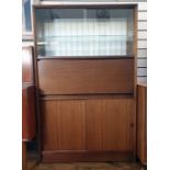 Mid 20th century teak lounge unit with two glazed sliding doors above cocktail cabinet fall, sliding
