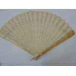 A 19th century Chinese export ivory brise fan, the guards with relief decoration of figures below