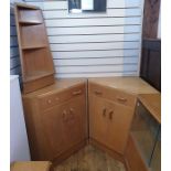 Pair of 20th century oak G-Plan corner cupboards, each with single drawer above two cupboard