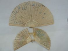 A bone and painted gauze fan, floral and bird decorated, (damaged), 35cm, a bone and painted fan,