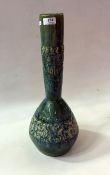 An Aw Eng Kwang pottery studio bottle vase, green glazed, Oriental town scene relief to bottle neck,