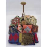 Sweetheart pincushion WWI, another vintage beaded pincushion, a hat/wig stand with a ceramic